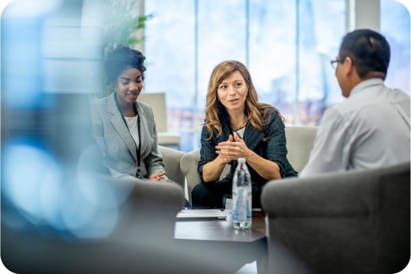 Team having a conversation in an office sitting area