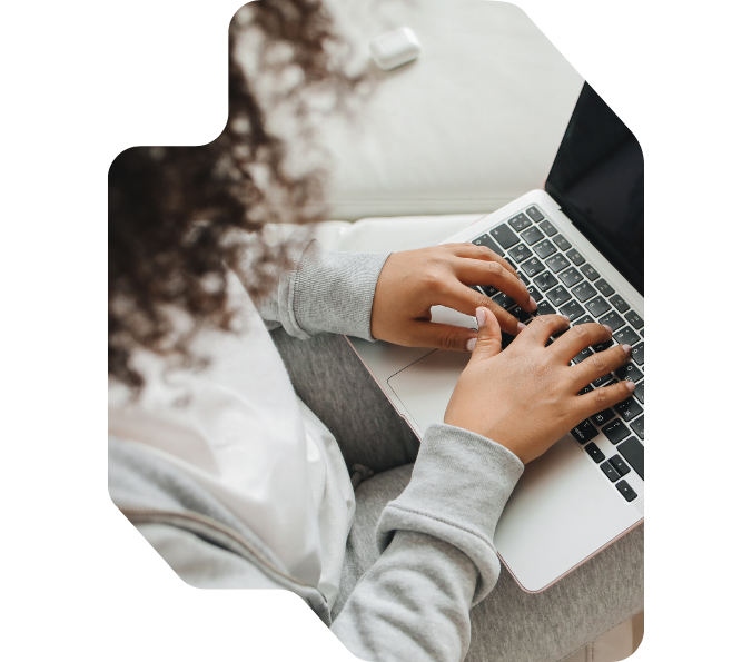 Woman typing on a laptop