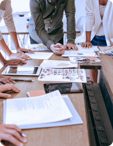 Vertical Formatted Images - People around a table of reports